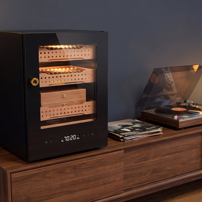 Afidano B1 400-count cigar humidor on a walnut media console beside a turntable in an apartment living room