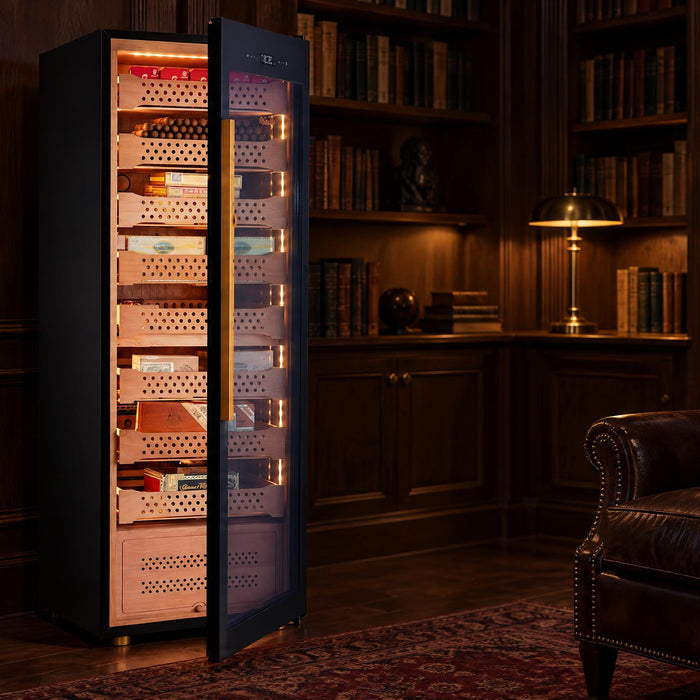 Afidano B8 cigar humidor with door open to lit Spanish cedar drawers in a dark wood library at night