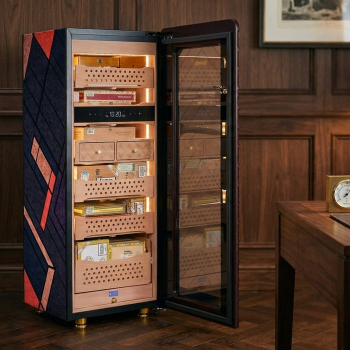 Afidano C5 electric cigar humidor open in a walnut study, revealing its lit Spanish cedar drawers stocked with cigars