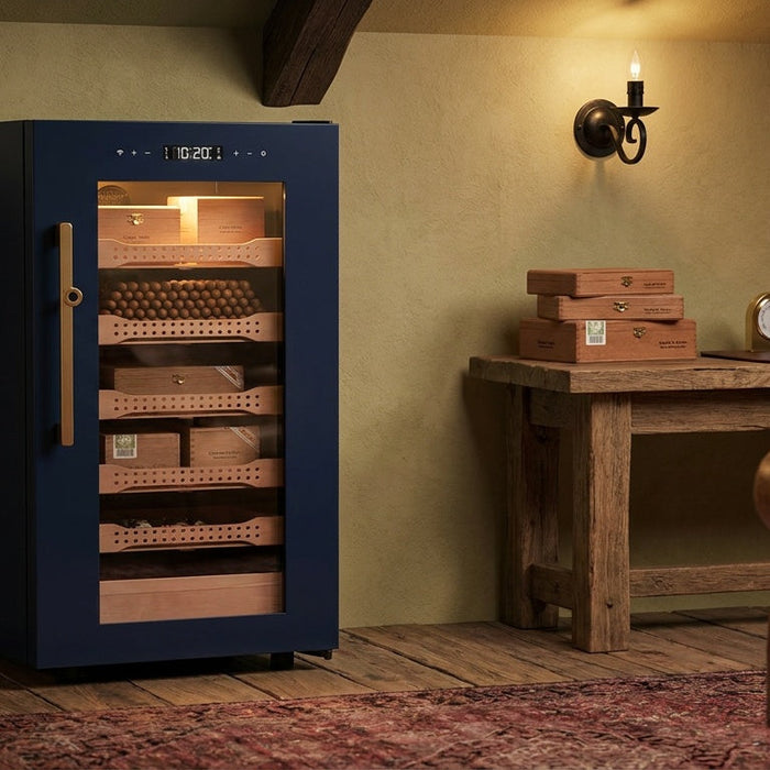 Afidano B4 1200-count cigar humidor with Spanish cedar trays in a beamed loft cigar room, glass door lit