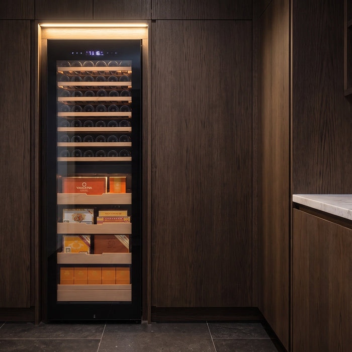 Afidano dual-zone cigar and wine cabinet recessed flush into dark oak joinery in a butler's pantry bar