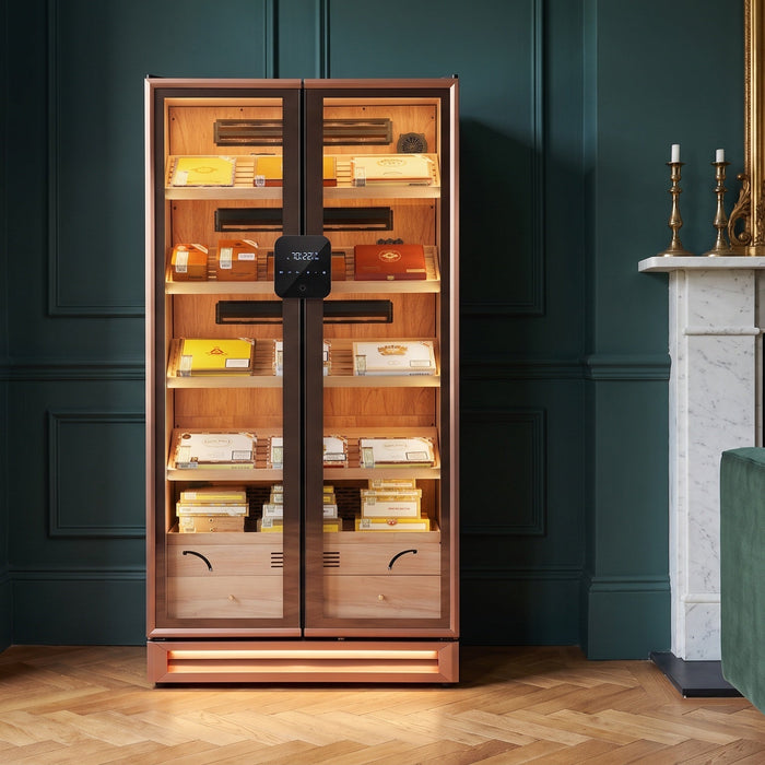 Afidano double-door glass cigar display cabinet lit inside a teal-panelled Georgian drawing room with marble fireplace