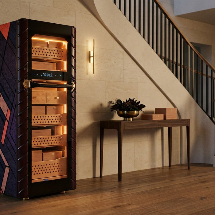 Afidano C5 Atelier electric cigar humidor with lit Spanish cedar trays in a limestone entrance hall at dusk