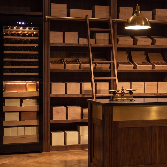 Afidano dual-zone commercial cigar humidor cabinet with wine and Spanish cedar shelves in a tobacconist shop