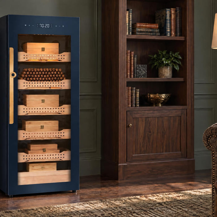Afidano B4 glass-door cigar humidor cabinet standing free between walnut bookcases in a green-panelled den
