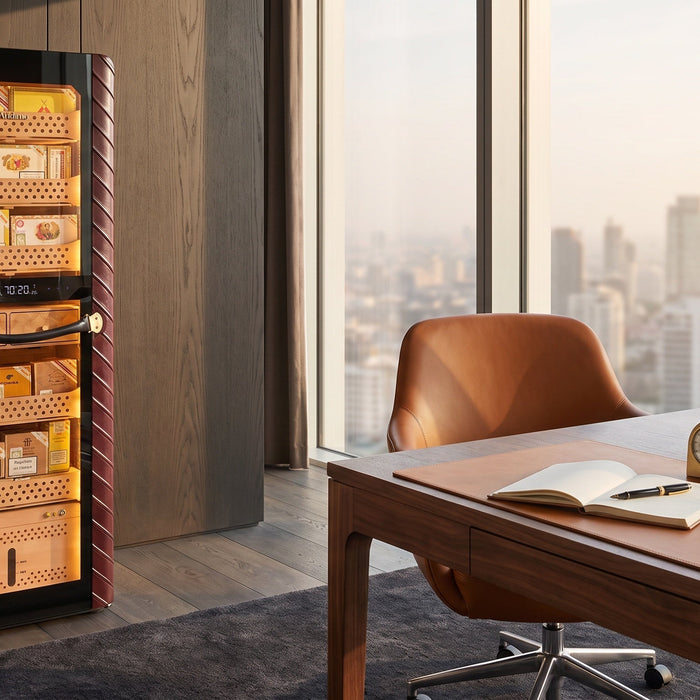 Afidano C8 Atelier electric cigar humidor with lit Spanish cedar trays in a high-rise corner office beside a walnut desk
