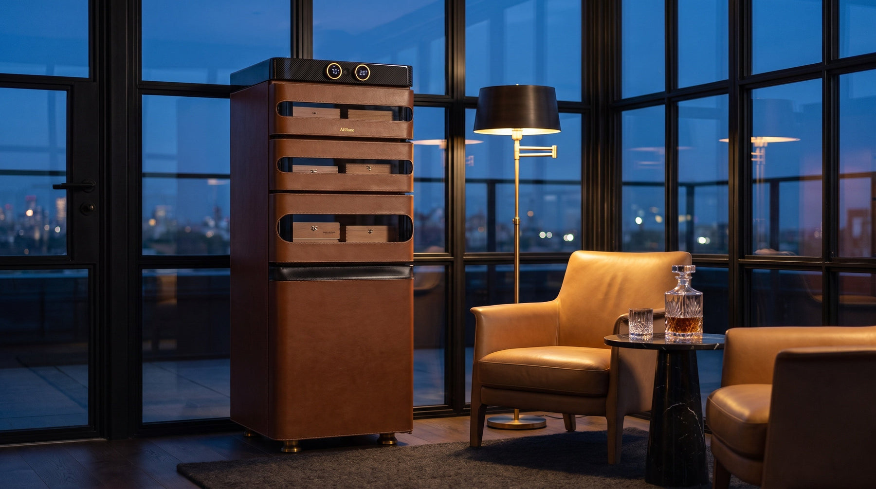 Afidano L5 Artistry leather cigar humidor with twin gold dials in a glass rooftop lounge at dusk over city lights