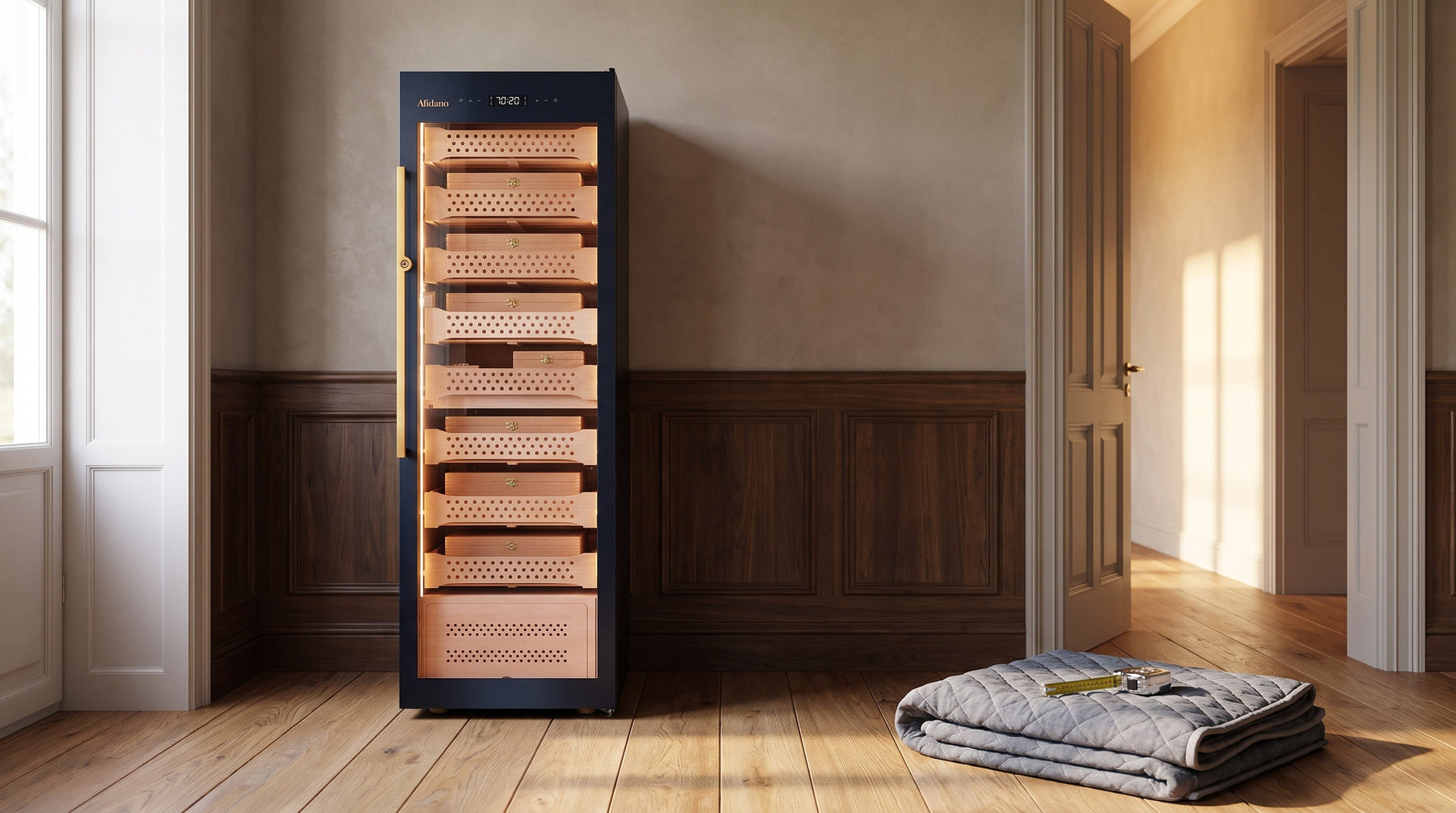 Afidano B8 2500-count cigar humidor cabinet just delivered to a sunlit study, moving blanket and tape measure beside it