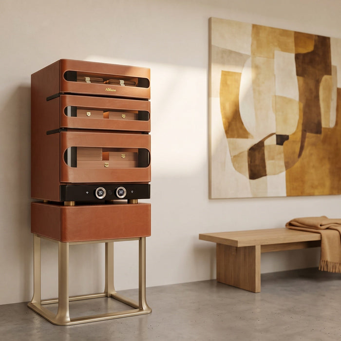 Afidano L3 standing cigar humidor in cognac leather on its champagne-gold stand in a bright gallery-style hallway