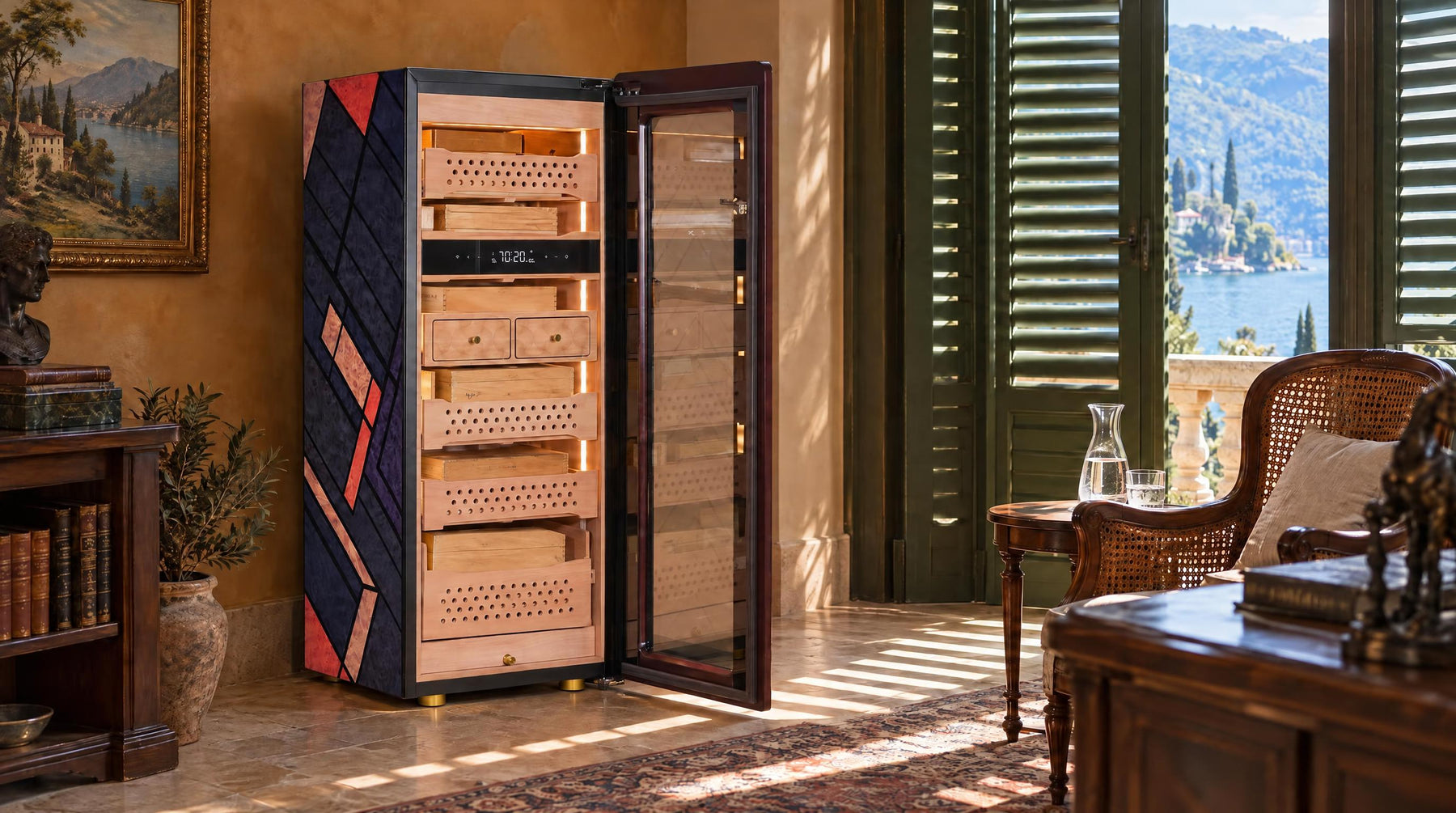 Afidano C5 Atelier cigar humidor open to reveal Spanish cedar drawers in a shaded lakeside villa study