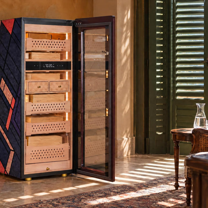 Afidano C5 Atelier cigar humidor open to reveal Spanish cedar drawers in a shaded lakeside villa study