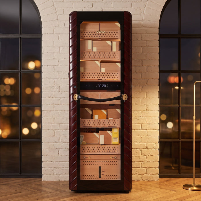 Afidano C8 tower cigar humidor in ribbed oxblood leather between arched windows of a city apartment at night