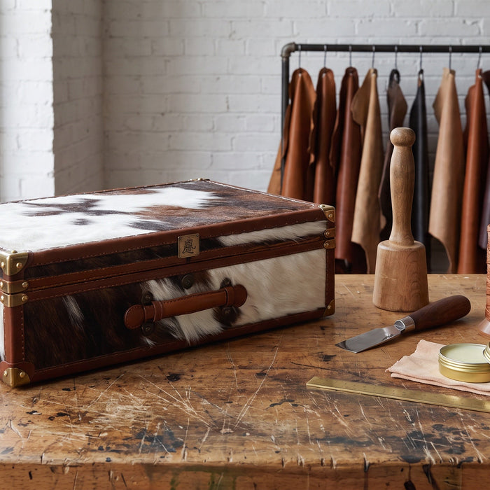 Afidano Year of the Horse horsehair and leather cigar humidor on a leatherworker's bench with hand tools